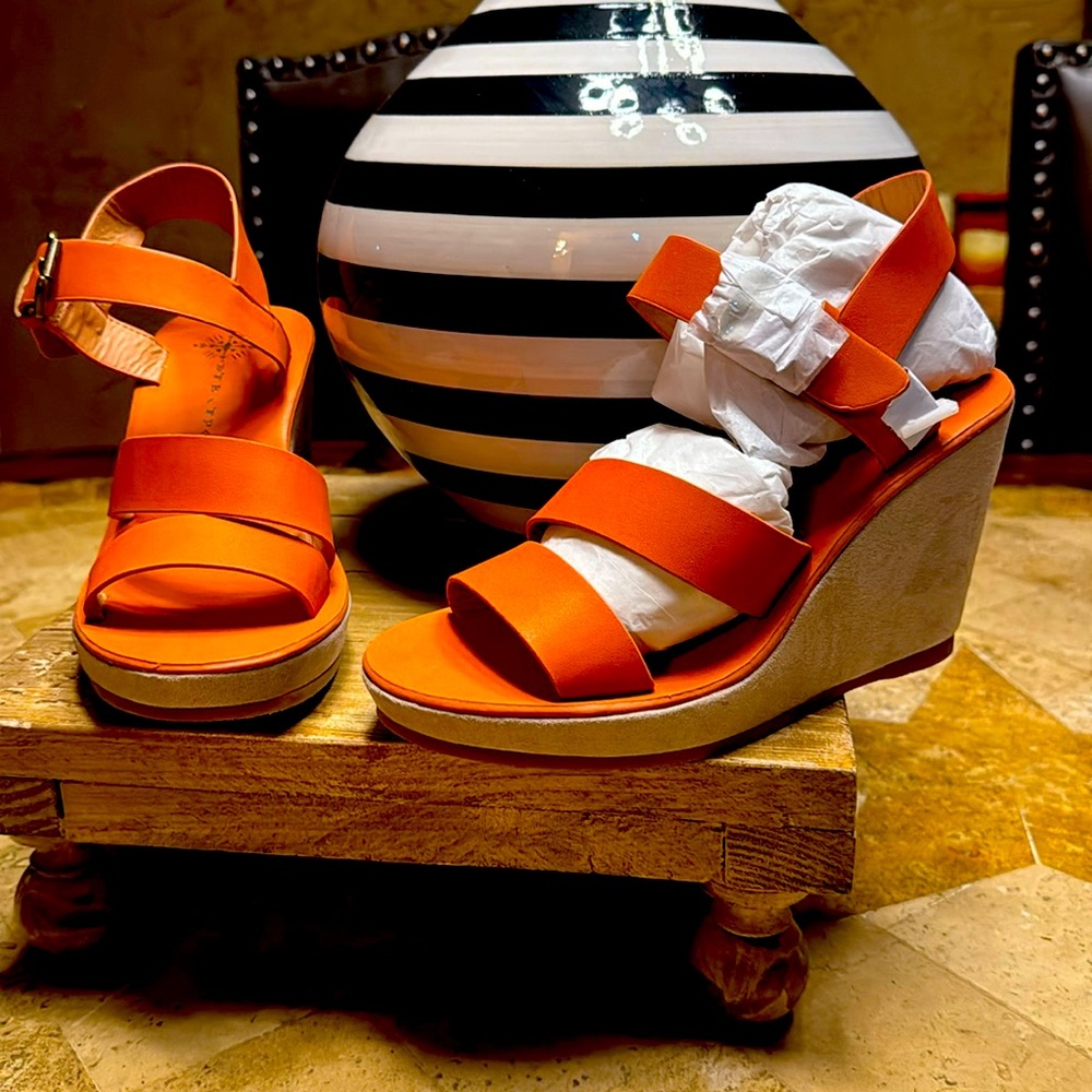 Free people wedge sandal in orange with nubuck wedge heel.